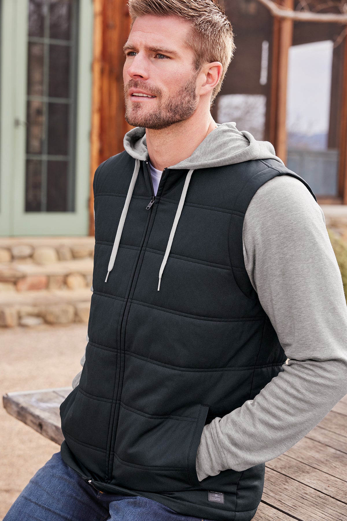 TravisMathew Tides Up Hooded Jacket in Black/ Grey Heather, view on model