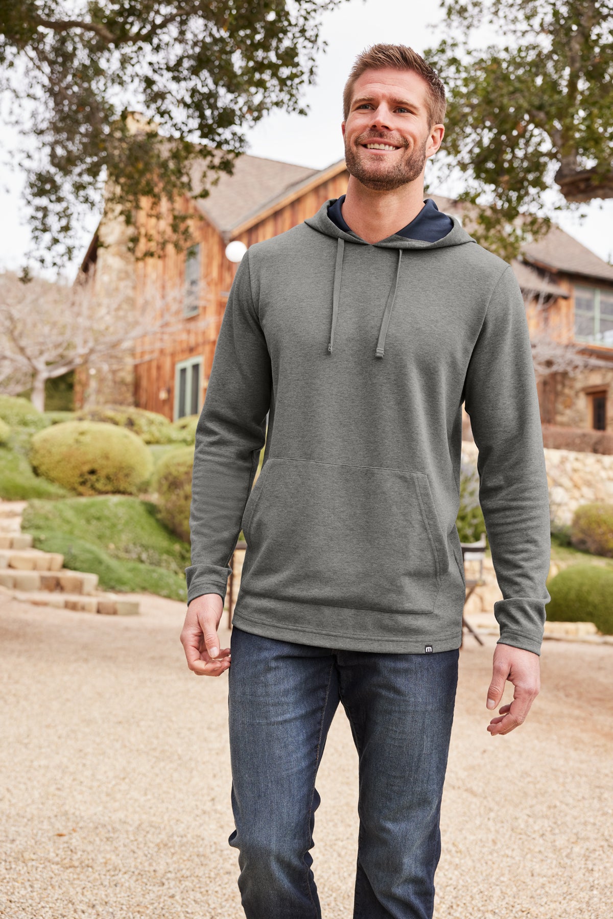 TravisMathew Coveside Hoodie in Dark Grey Heather, view on model