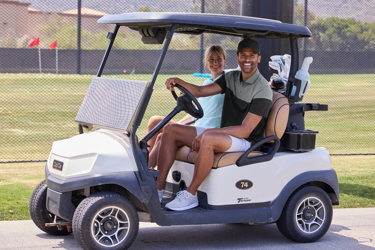 TravisMathew Onward Colorblock Polo in Quiet Shade Grey Heather/ Black, view on model
