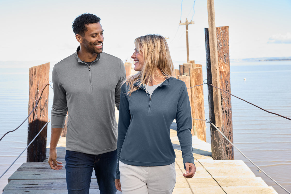 TravisMathew Women’s Coto 1/2-Zip in Vintage Indigo/ Black, view on model