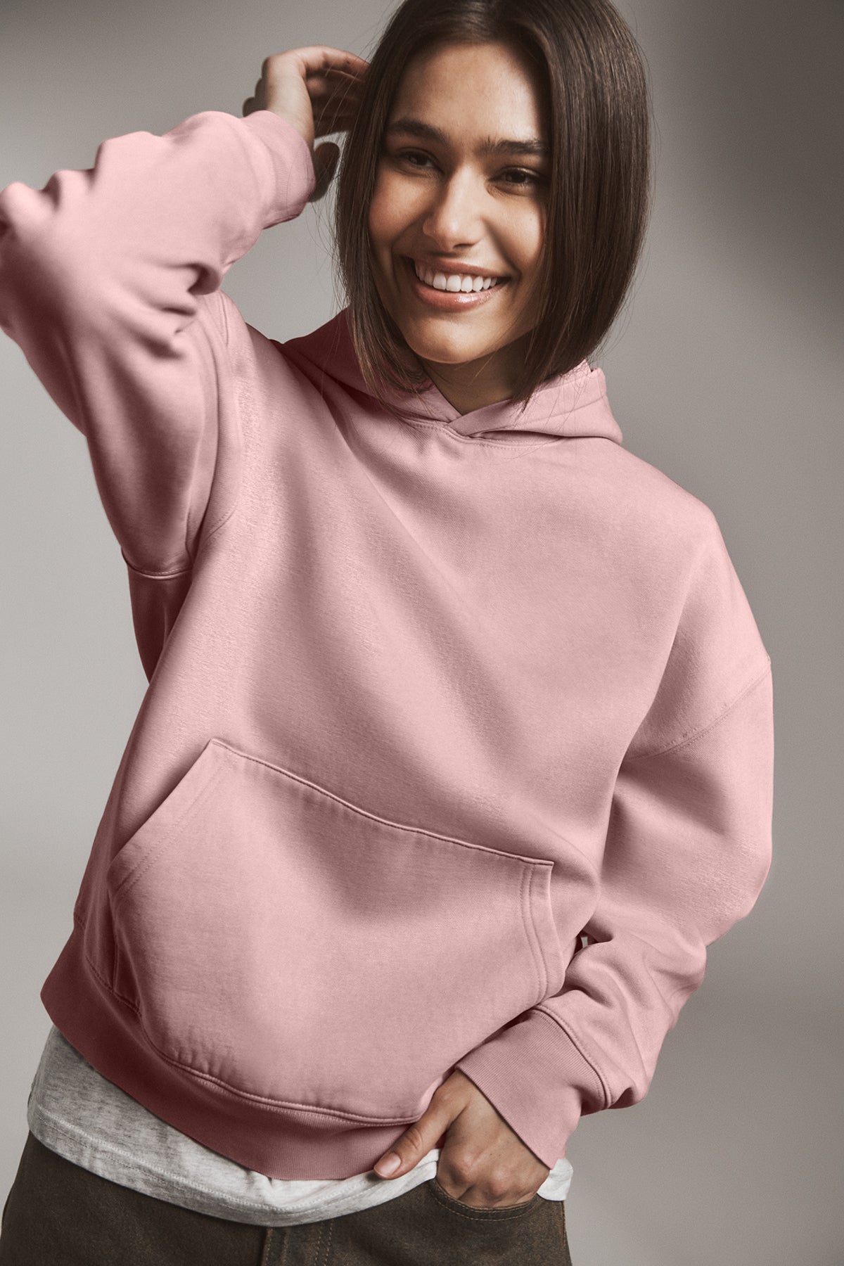 Stanley/Stella Unisex Chaser Vintage Hooded Sweatshirt in G. Dyed Misty Grey, view on model