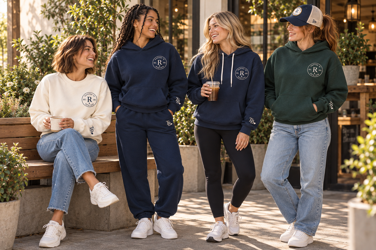 Friends wearing Rooted in Renton hoodies, a crewneck and sweatpants