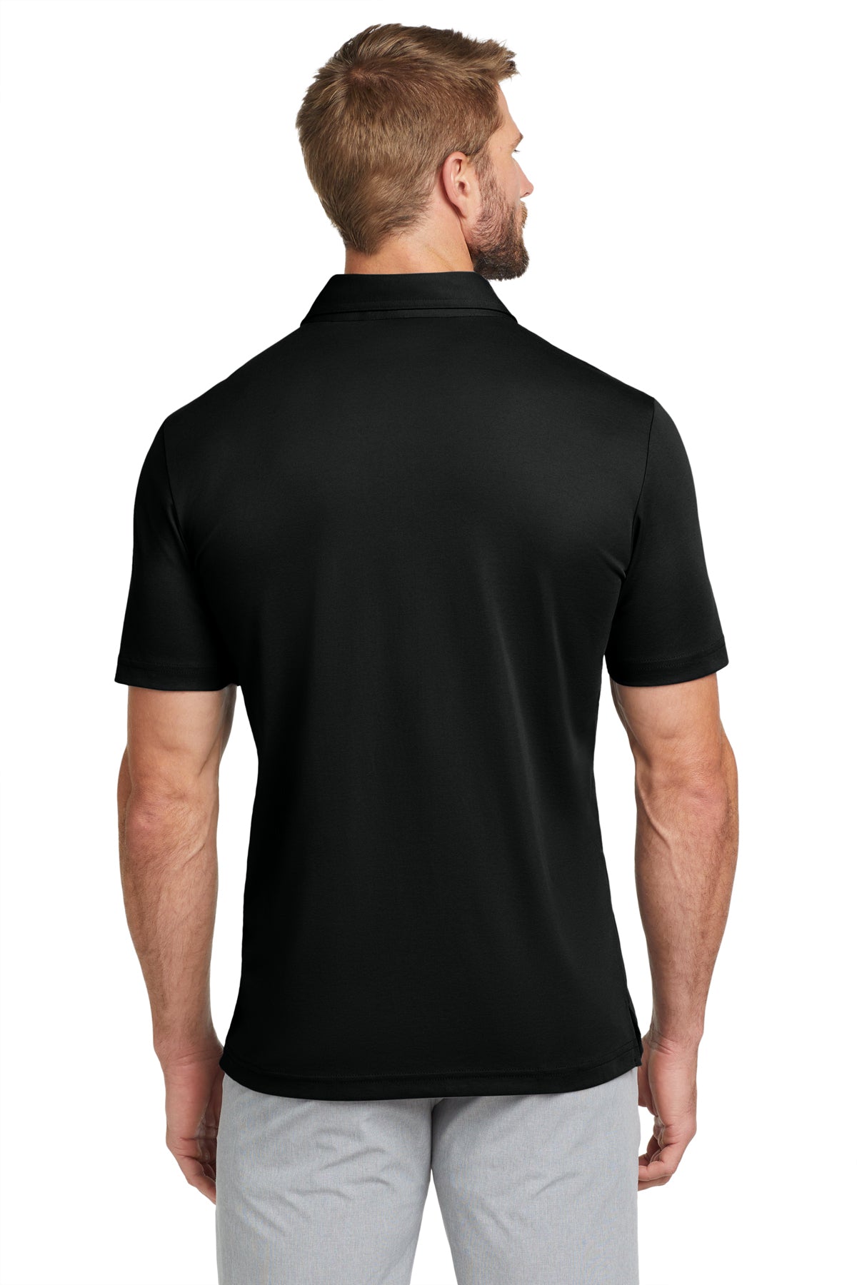 TravisMathew Oceanside Solid Polo in Black, back on model
