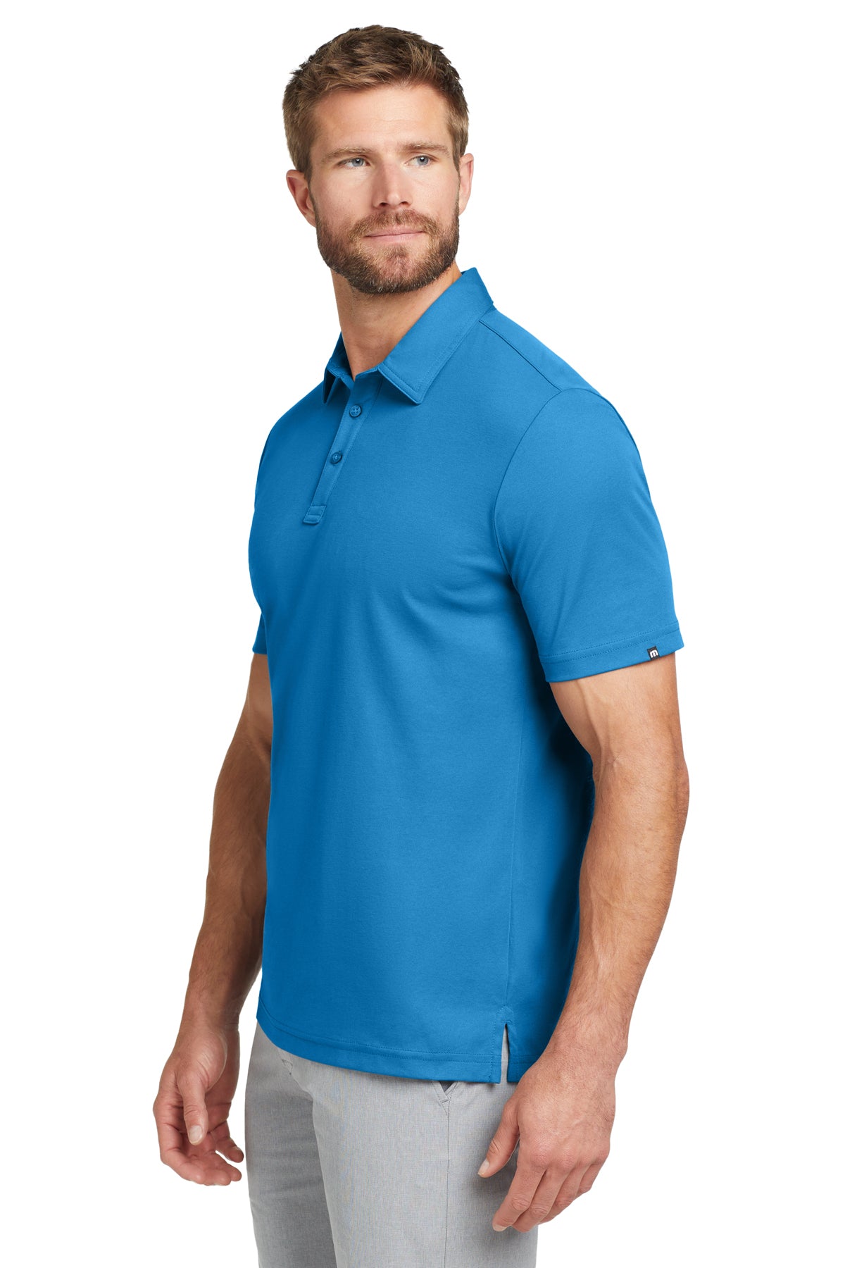 TravisMathew Oceanside Solid Polo in Classic Blue, side on model
