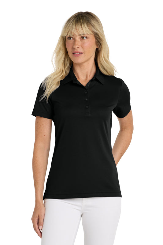 TravisMathew Women's Oceanside Solid Polo in Black, front on model