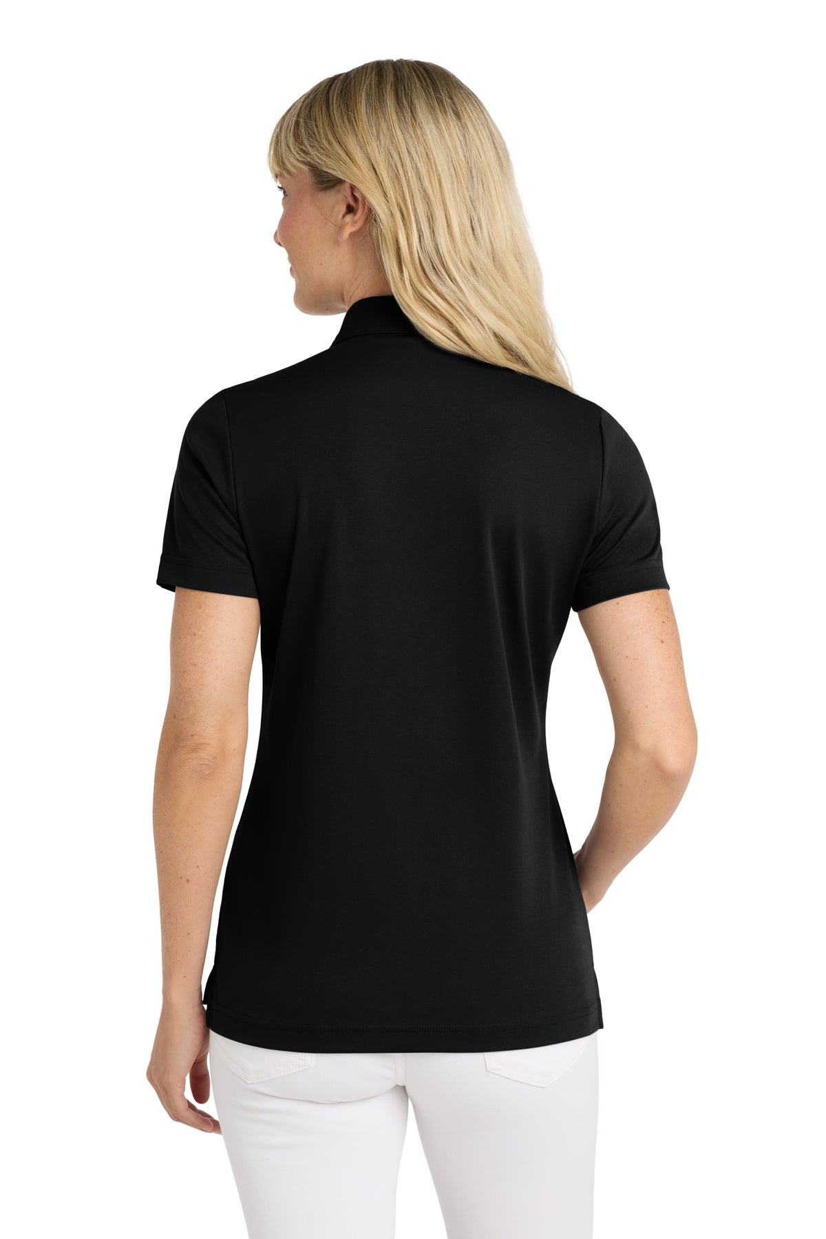 TravisMathew Women's Oceanside Solid Polo in Black, back on model