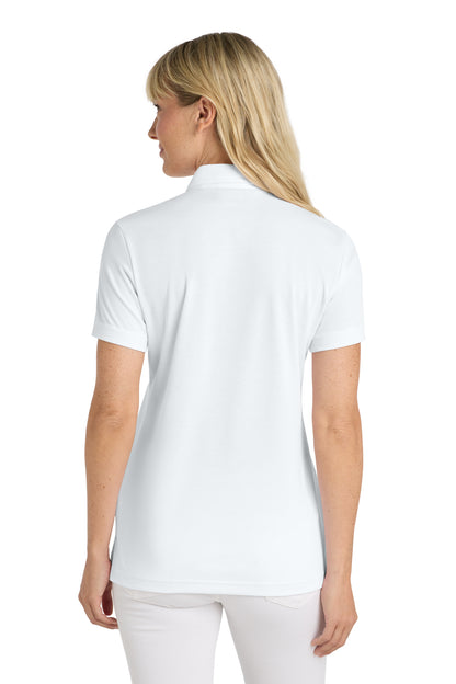 TravisMathew Women's Oceanside Solid Polo in White, back on model