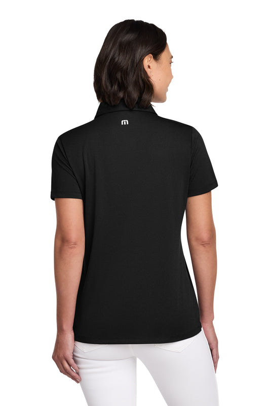 TravisMathew Women's Coto Performance Polo in Black, back on model