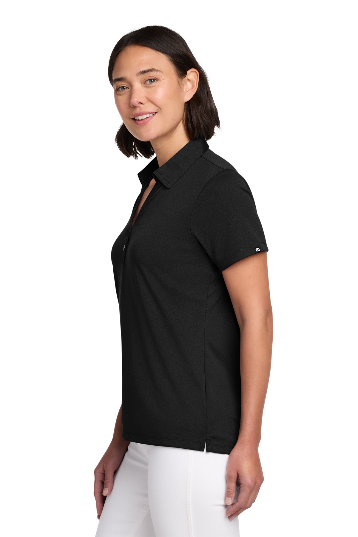 TravisMathew Women's Coto Performance Polo in Black, side on model