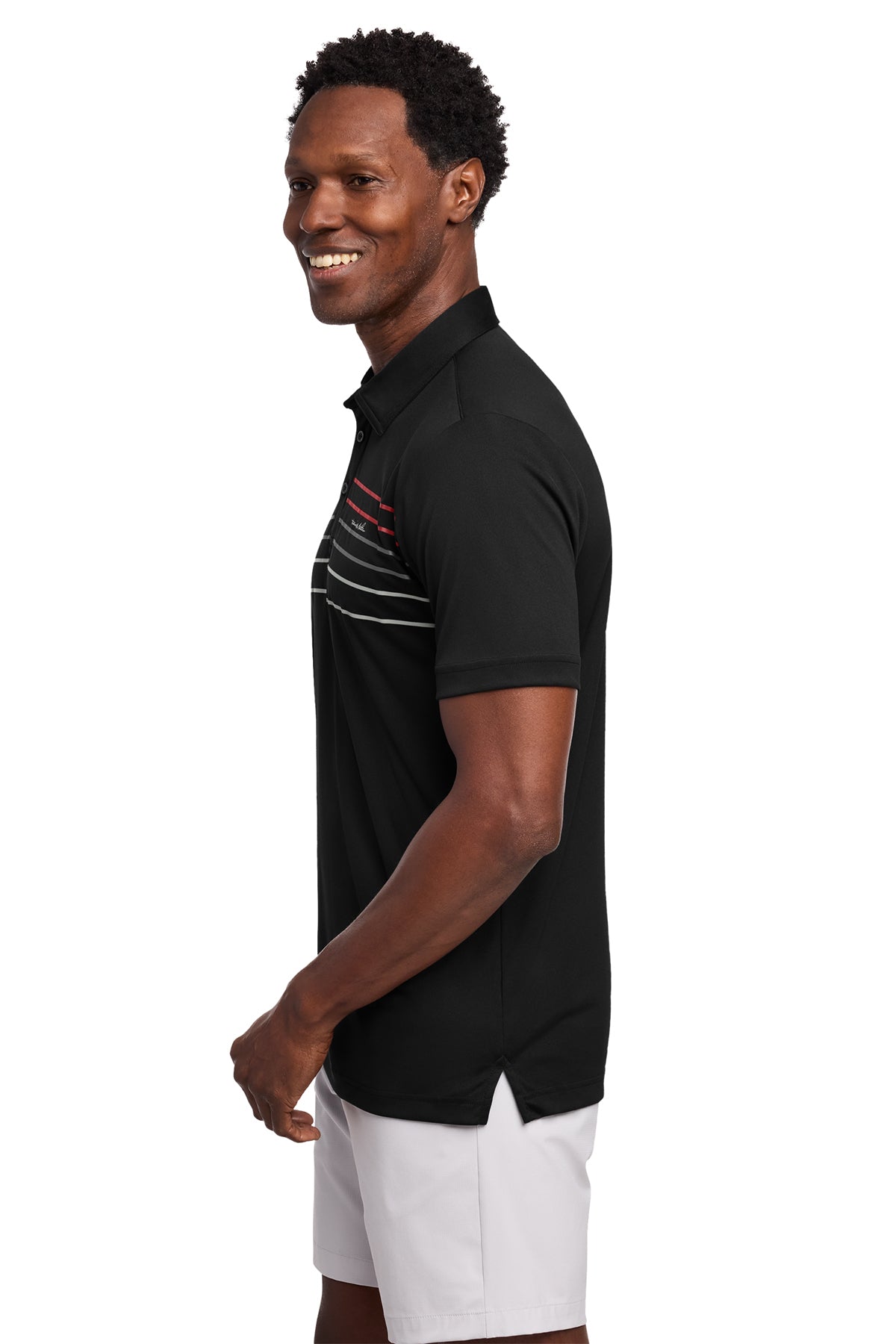 TravisMathew Coto Performance Chest Stripe Polo in Black, side on model