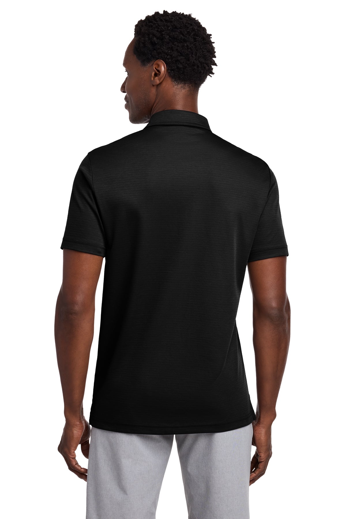 TravisMathew Bayfront Solid Polo in Black, back on model