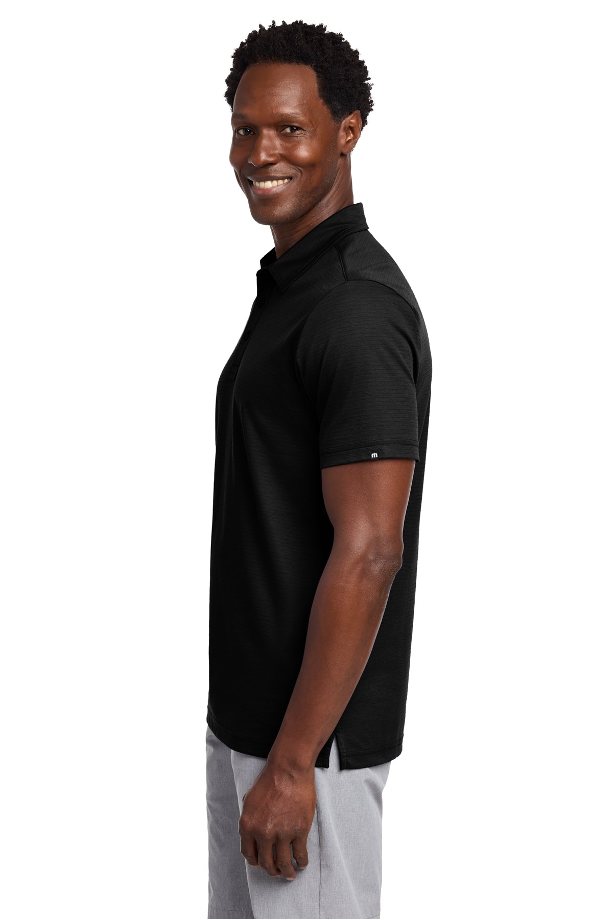 TravisMathew Bayfront Solid Polo in Black, side on model
