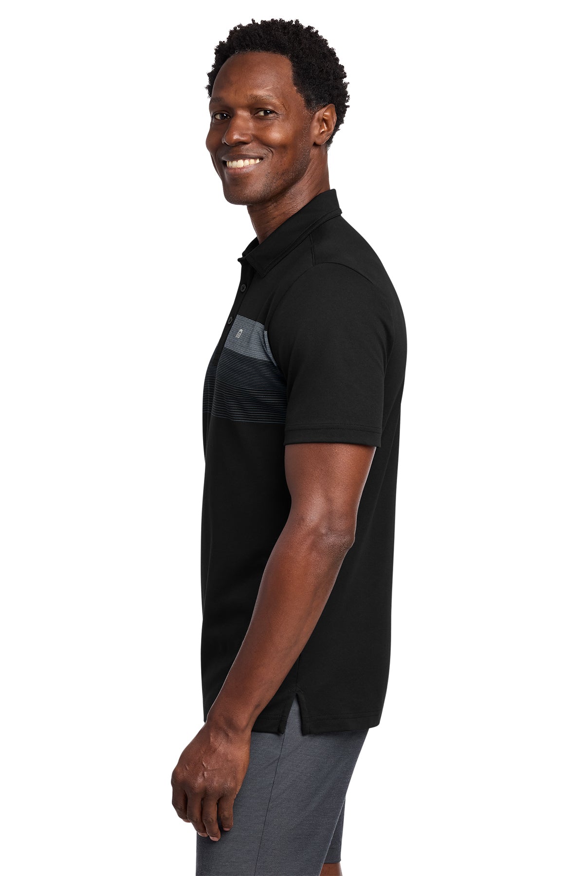 TravisMathew Coastal Chest Stripe Polo in Black, side on model