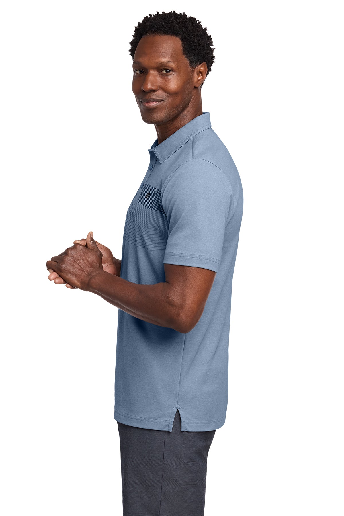 TravisMathew Coastal Chest Stripe Polo in Opal Blue Heather, side on model