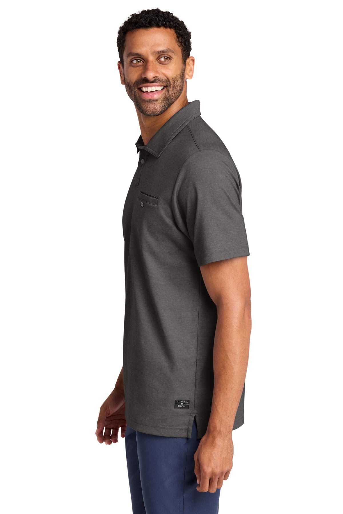 TravisMathew Sunsetters Pocket Polo in Black Heather, side on model