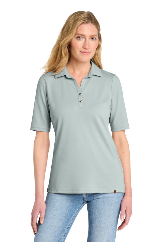 TravisMathew Women's Sunsetters Polo in Balsam Green Heather, front on model