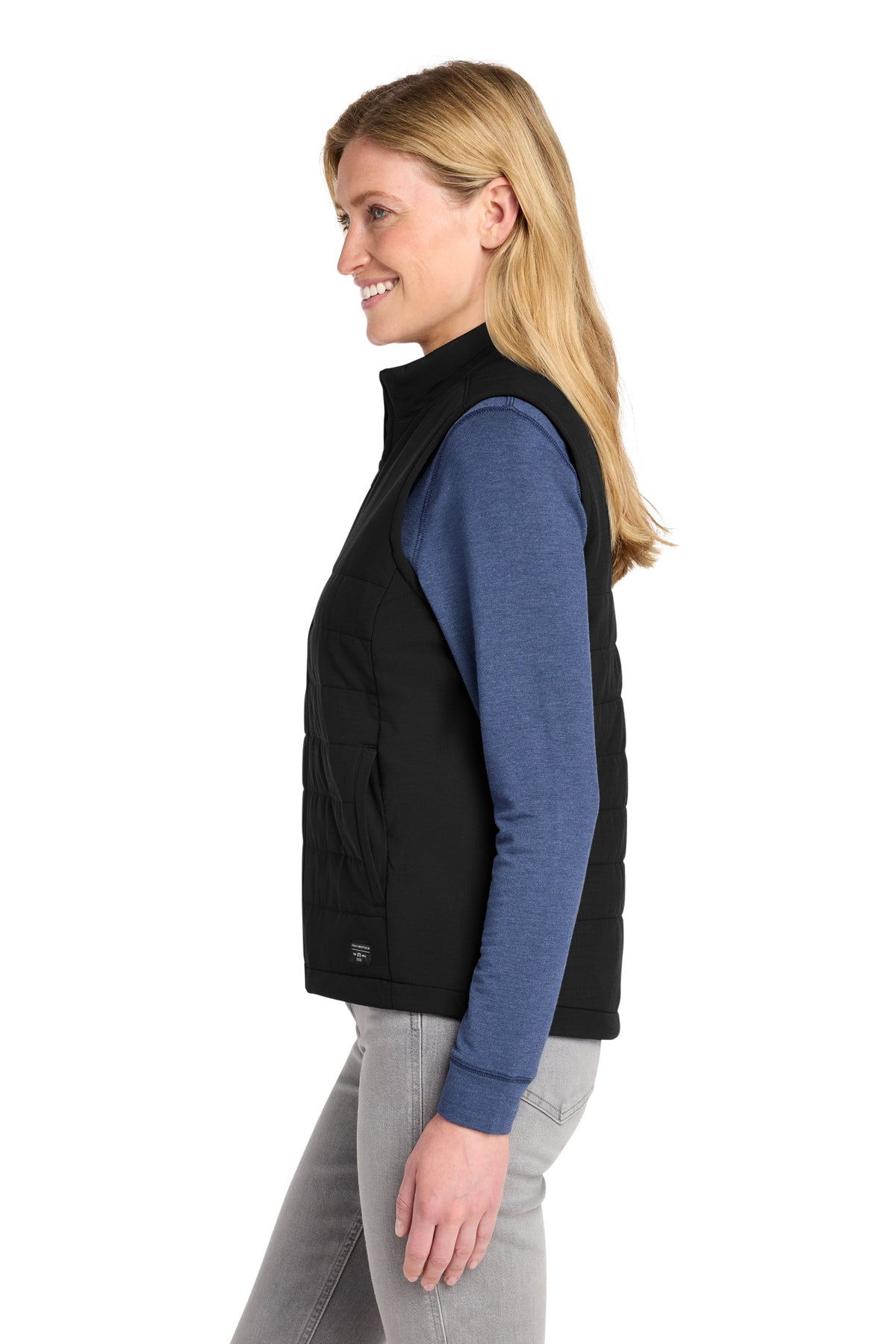 TravisMathew Women's Cold Bay Vest in Black, side on model