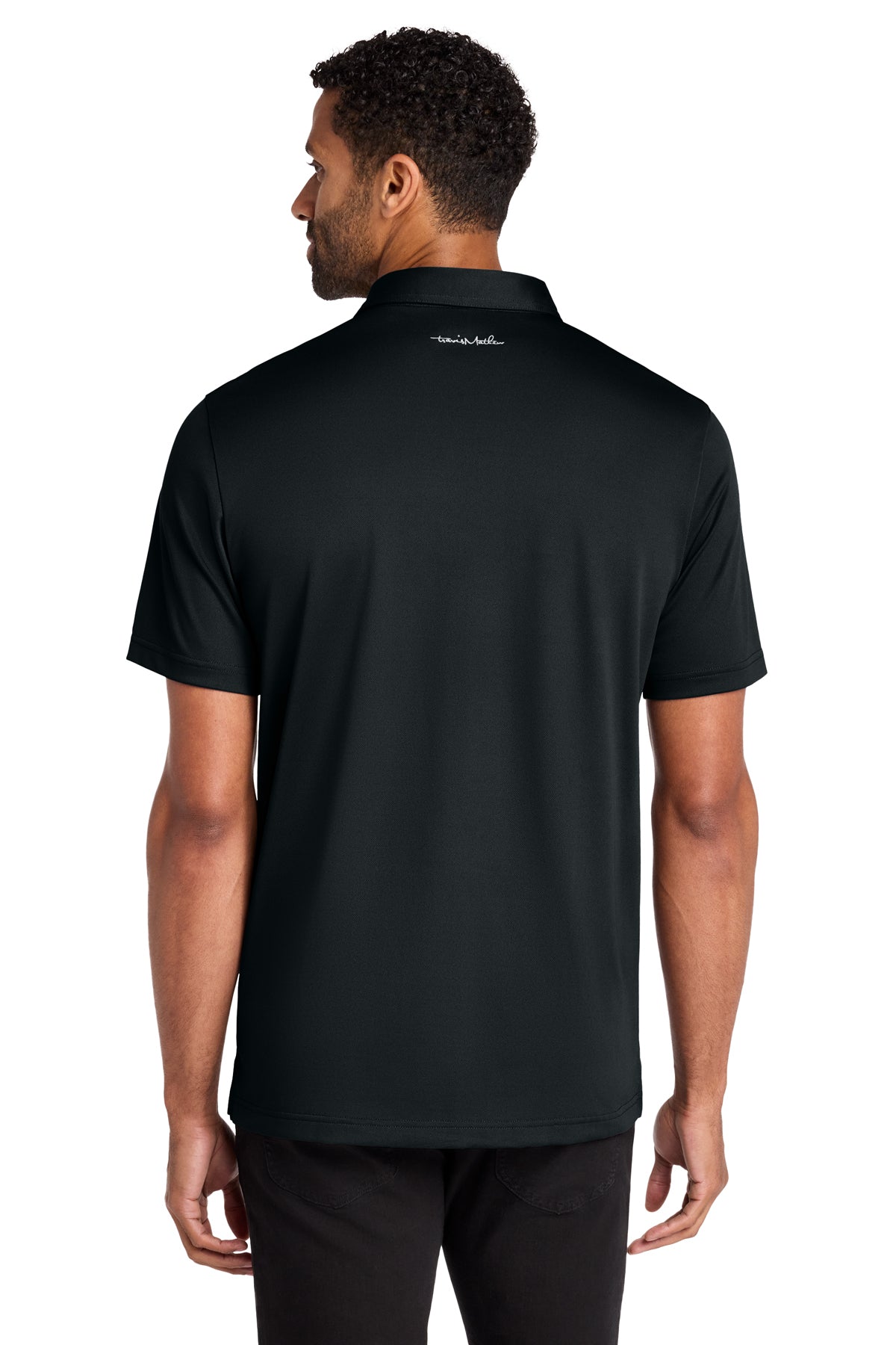 TravisMathew Cabana Solid Polo in Black, back on model