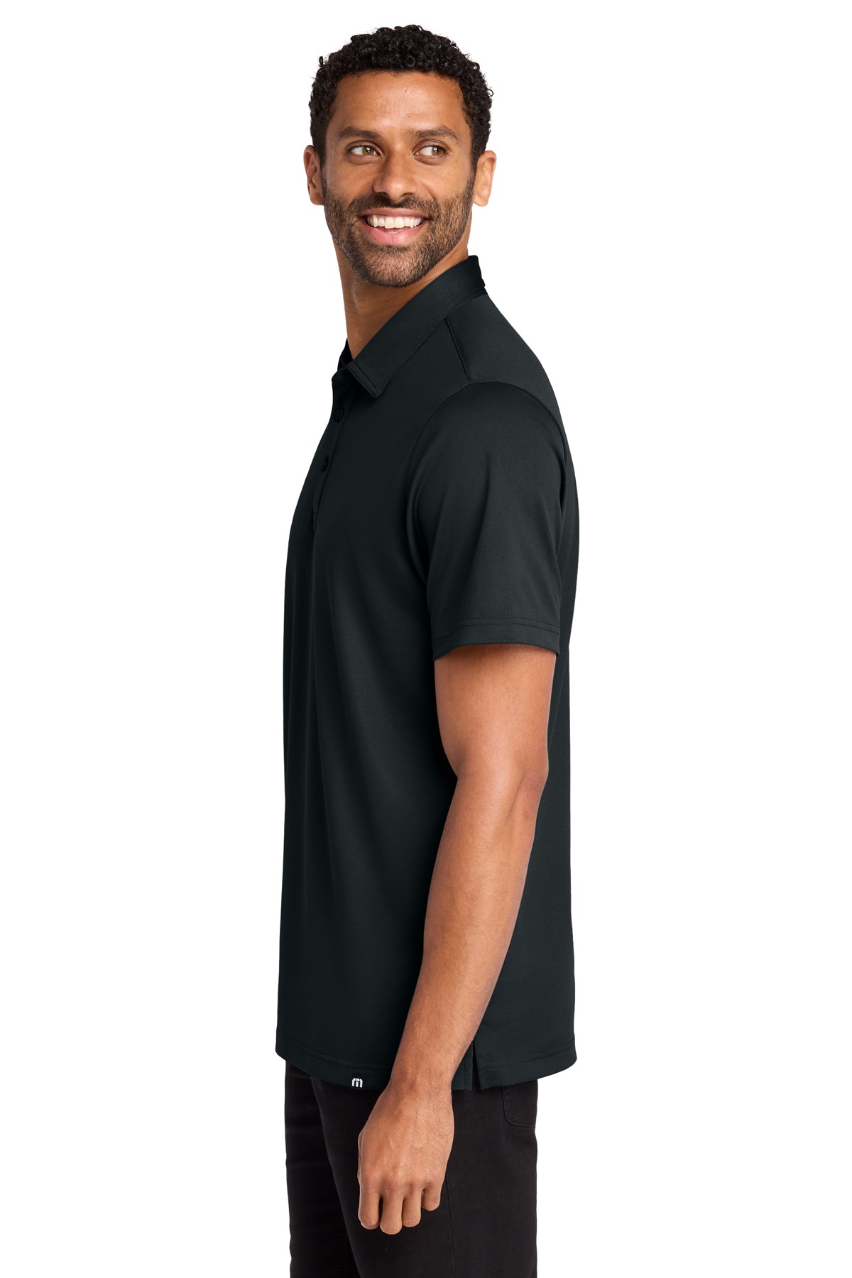 TravisMathew Cabana Solid Polo in Black, side on model