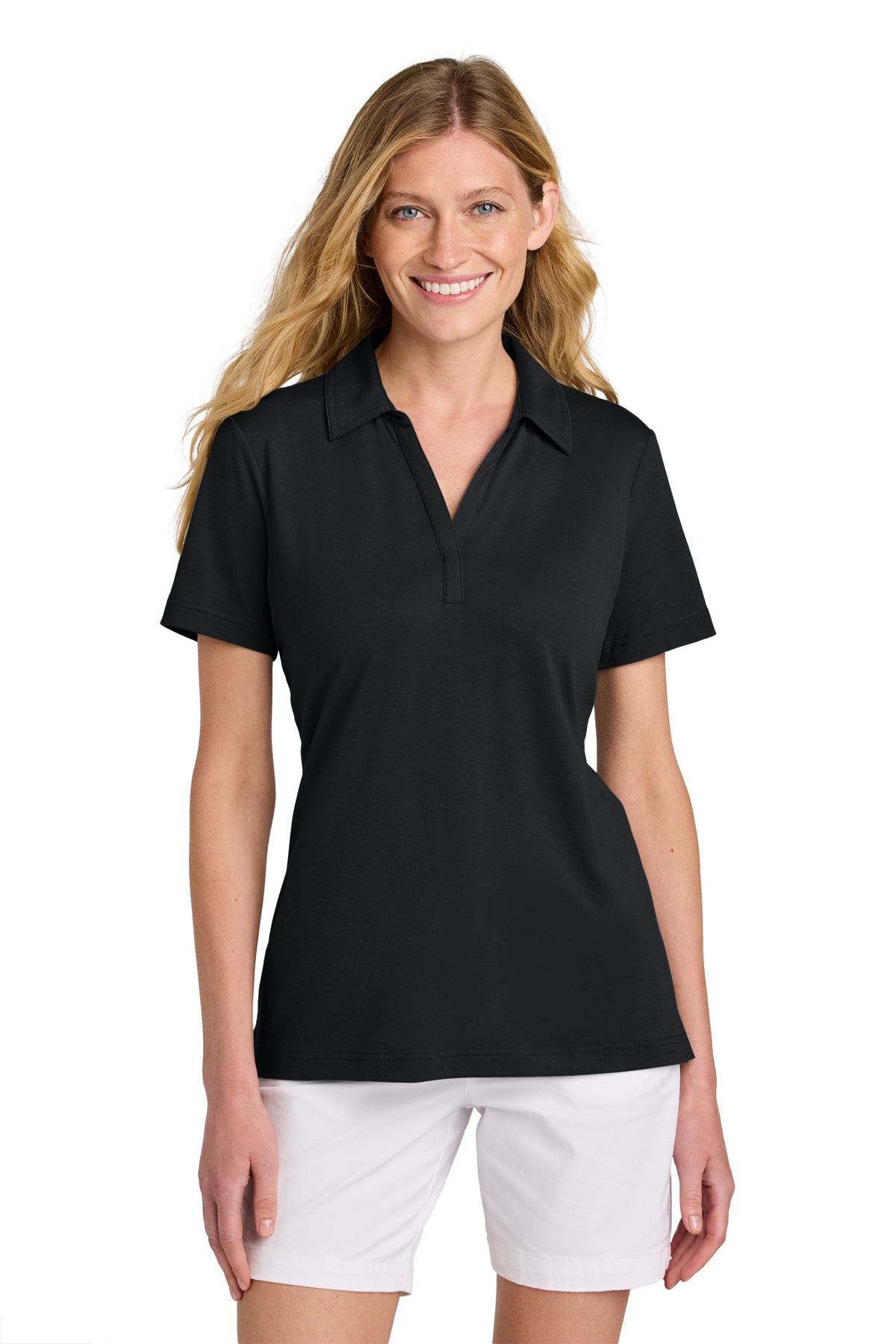 TravisMathew Women’s Glenview Solid Polo in Black, front on model
