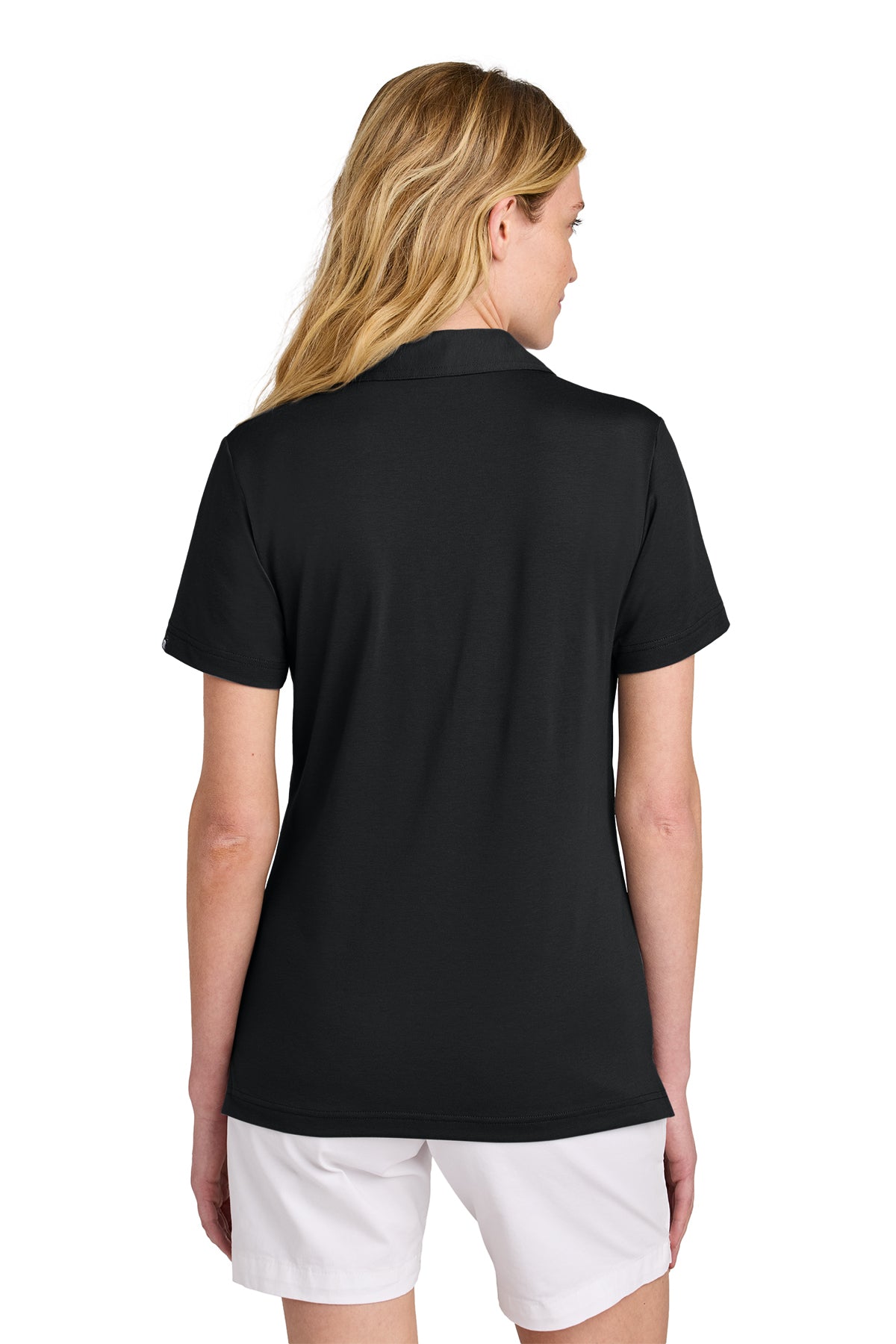 TravisMathew Women’s Glenview Solid Polo in Black, back on model