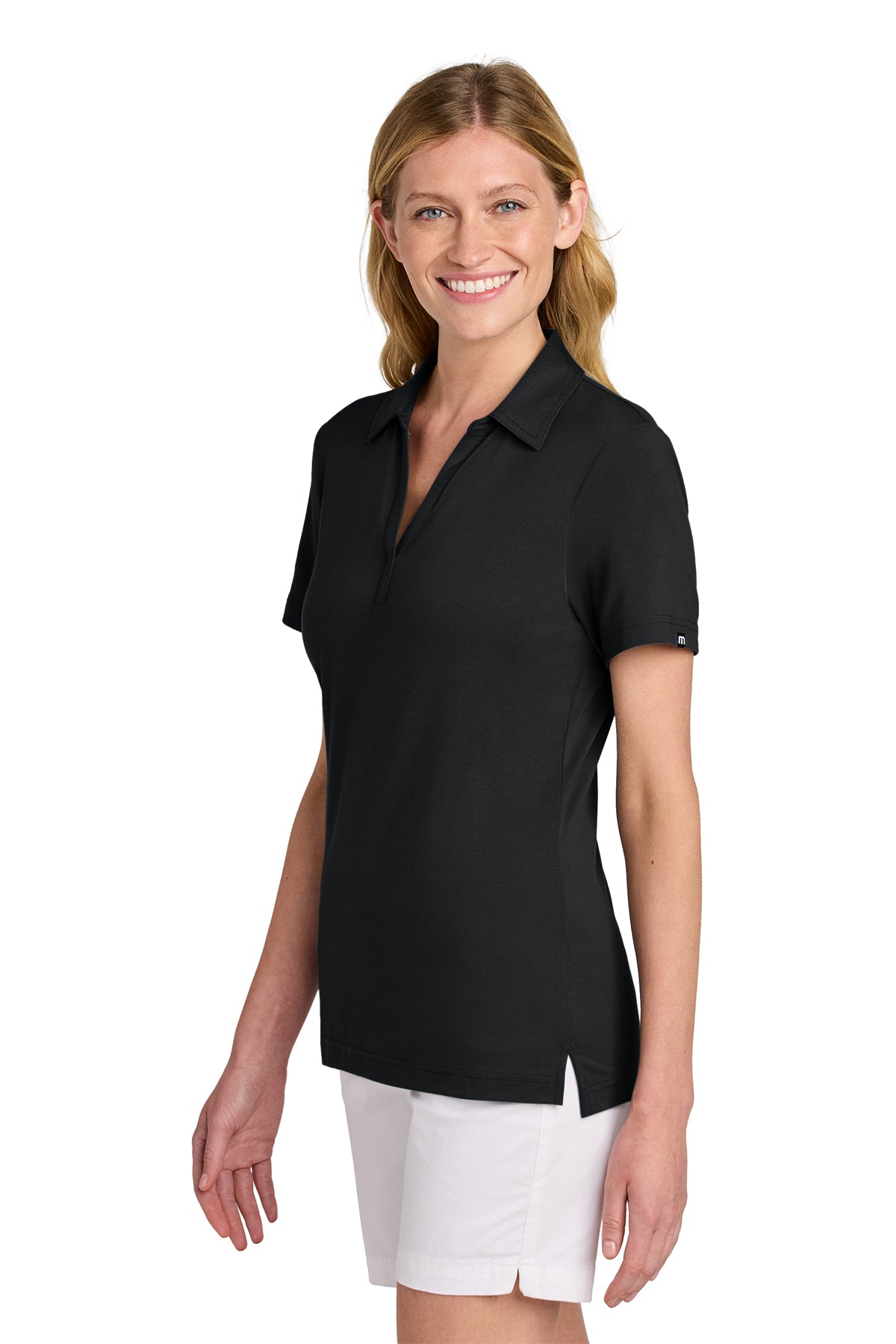 TravisMathew Women’s Glenview Solid Polo in Black, side on model