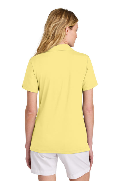 TravisMathew Women’s Glenview Solid Polo in Pale Yellow, back on model