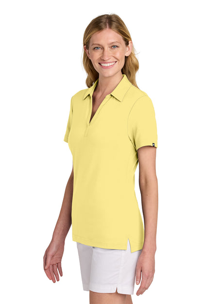 TravisMathew Women’s Glenview Solid Polo in Pale Yellow, side on model