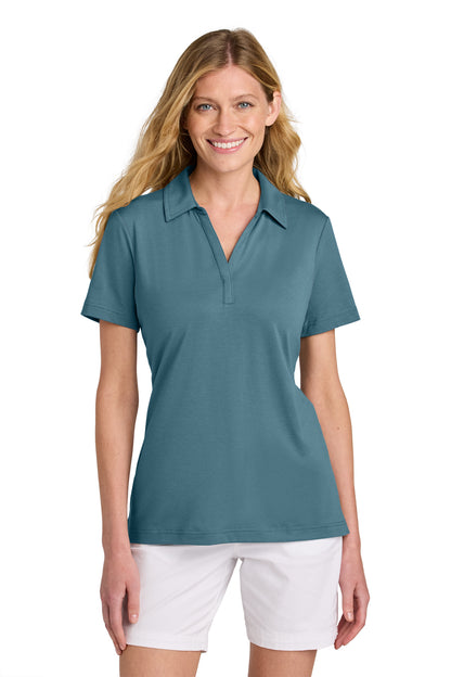 TravisMathew Women’s Glenview Solid Polo in Stellar Blue, front on model