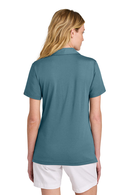 TravisMathew Women’s Glenview Solid Polo in Stellar Blue, back on model