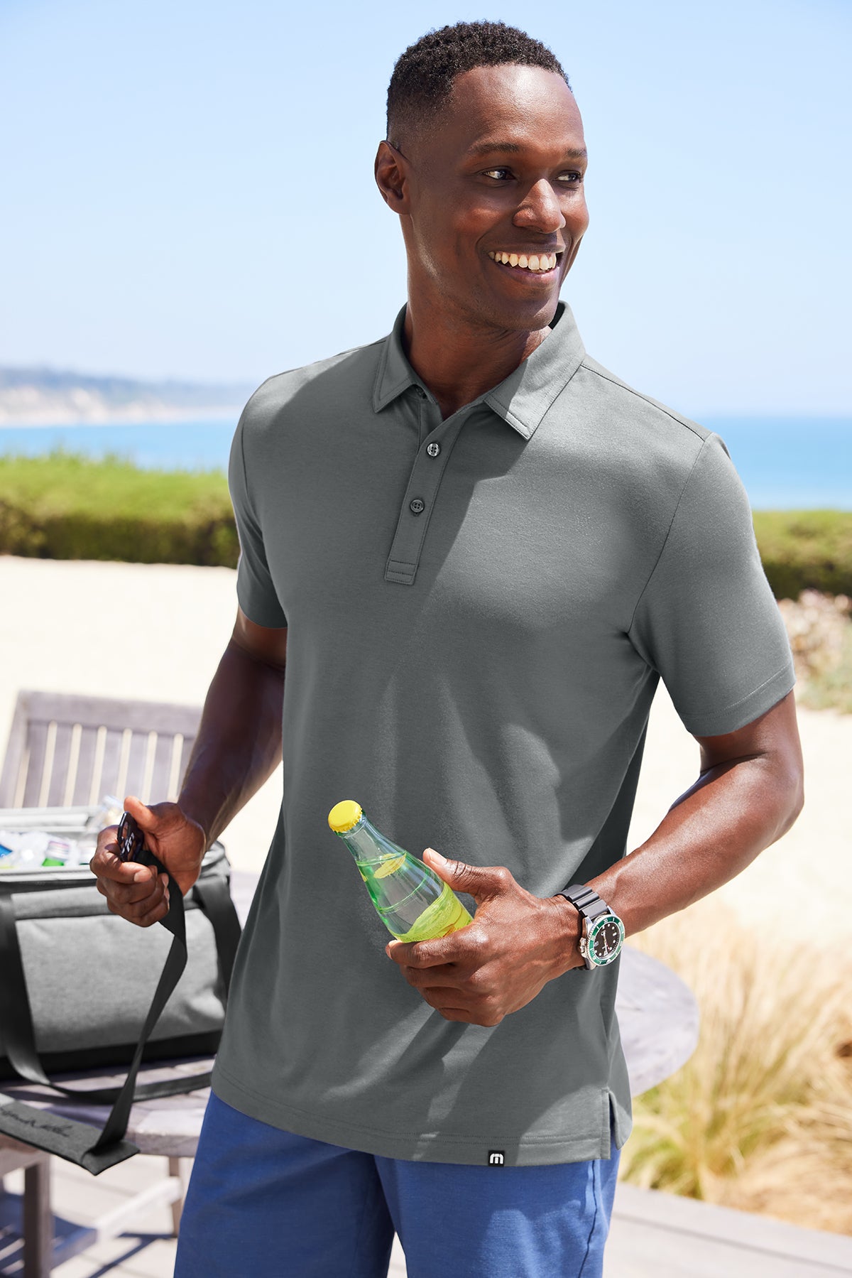 TravisMathew Glenview Solid Polo in Stellar Blue, view on model