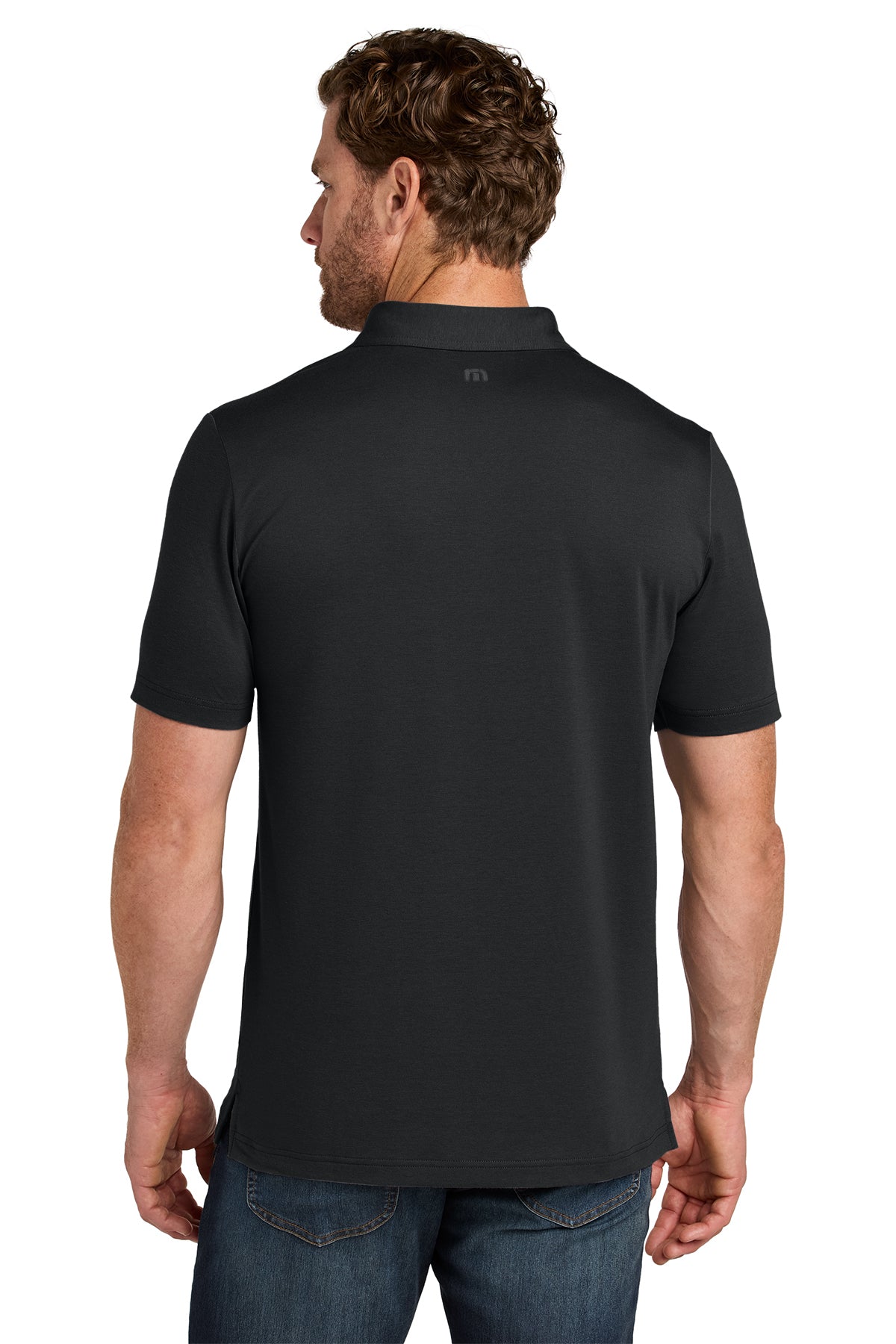 TravisMathew Glenview Solid Polo in Black, back on model