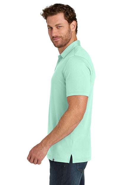 TravisMathew Glenview Solid Polo in Mint, side on model