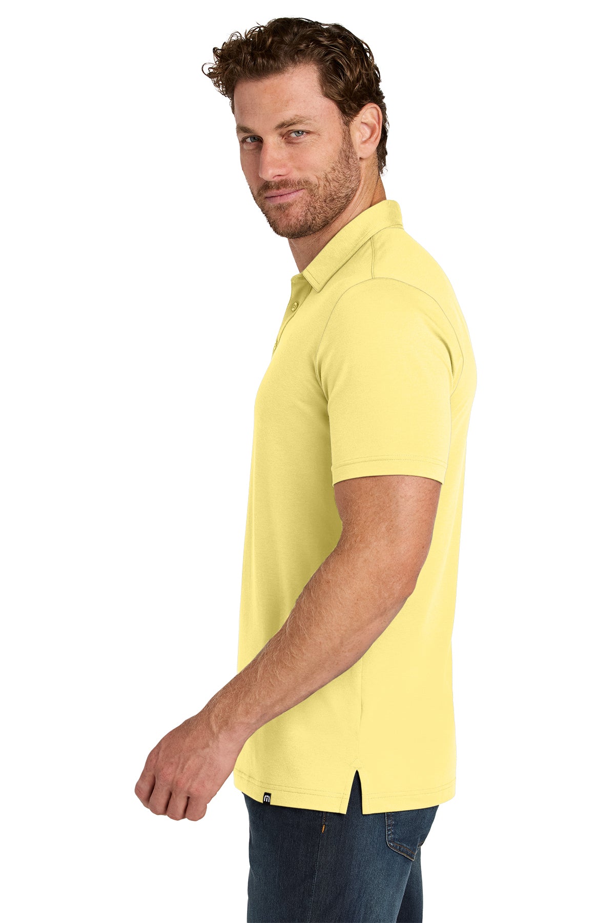 TravisMathew Glenview Solid Polo in Pale Yellow, side on model