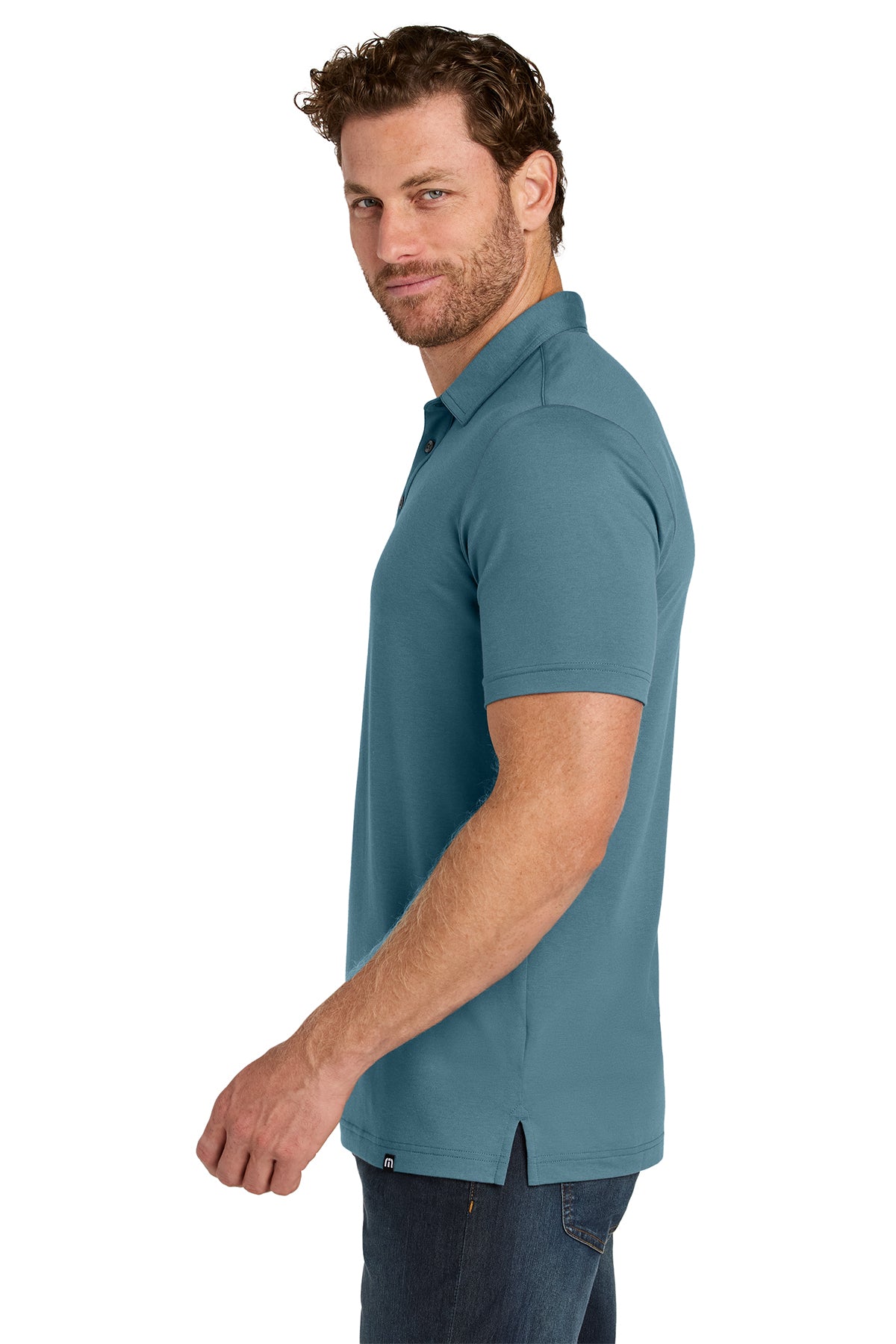 TravisMathew Glenview Solid Polo in Stellar Blue, side on model
