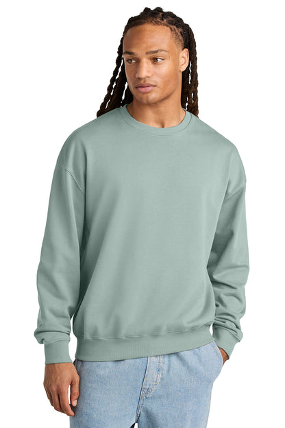Stanley/Stella Unisex Ledger Dry Crewneck Sweatshirt in Aloe, front on model