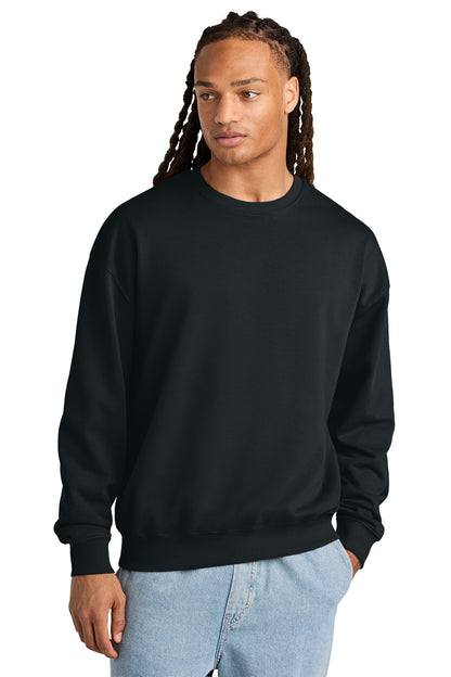 Stanley/Stella Unisex Ledger Dry Crewneck Sweatshirt in Black, front on model
