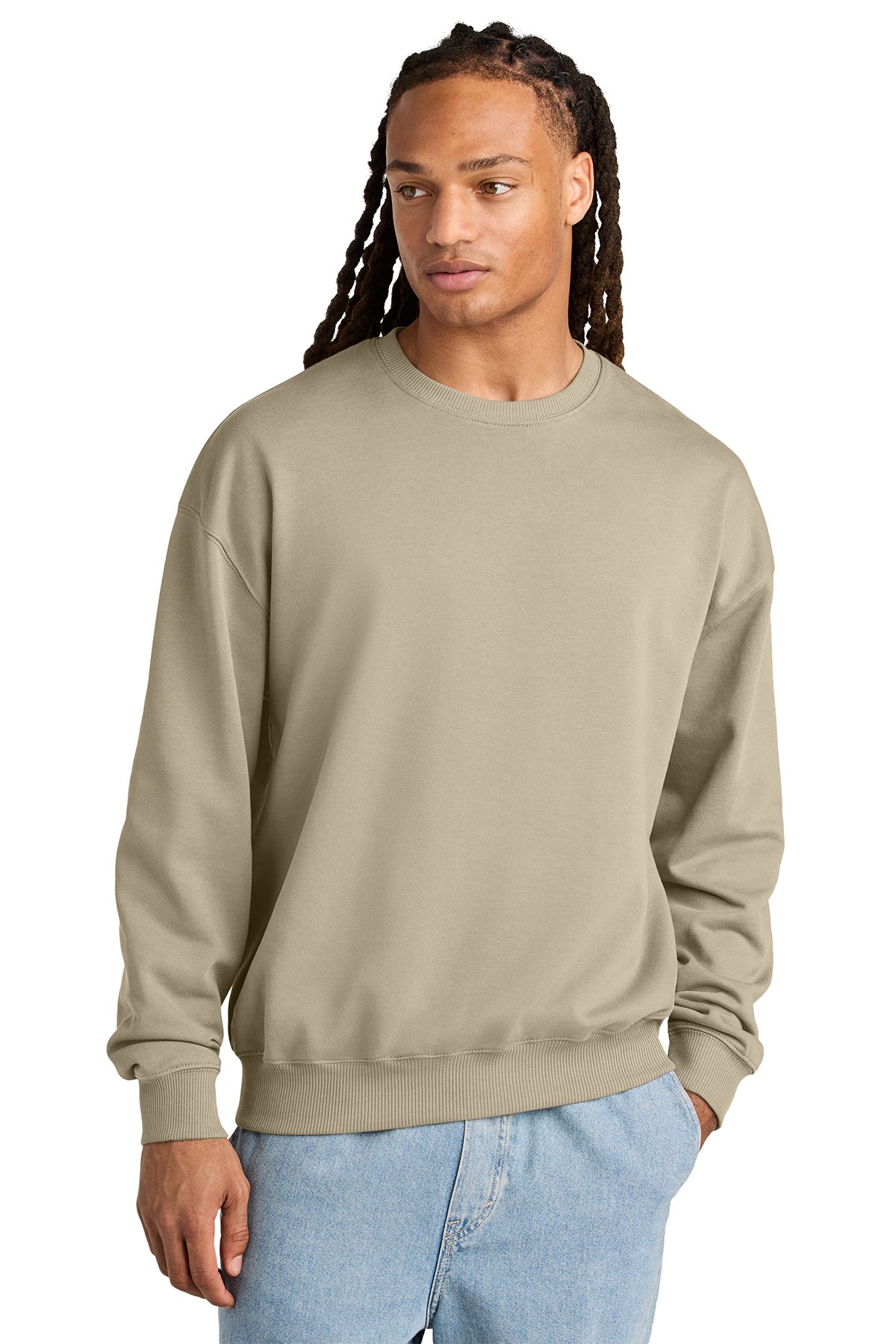 Stanley/Stella Unisex Ledger Dry Crewneck Sweatshirt in Desert Dust, front on model