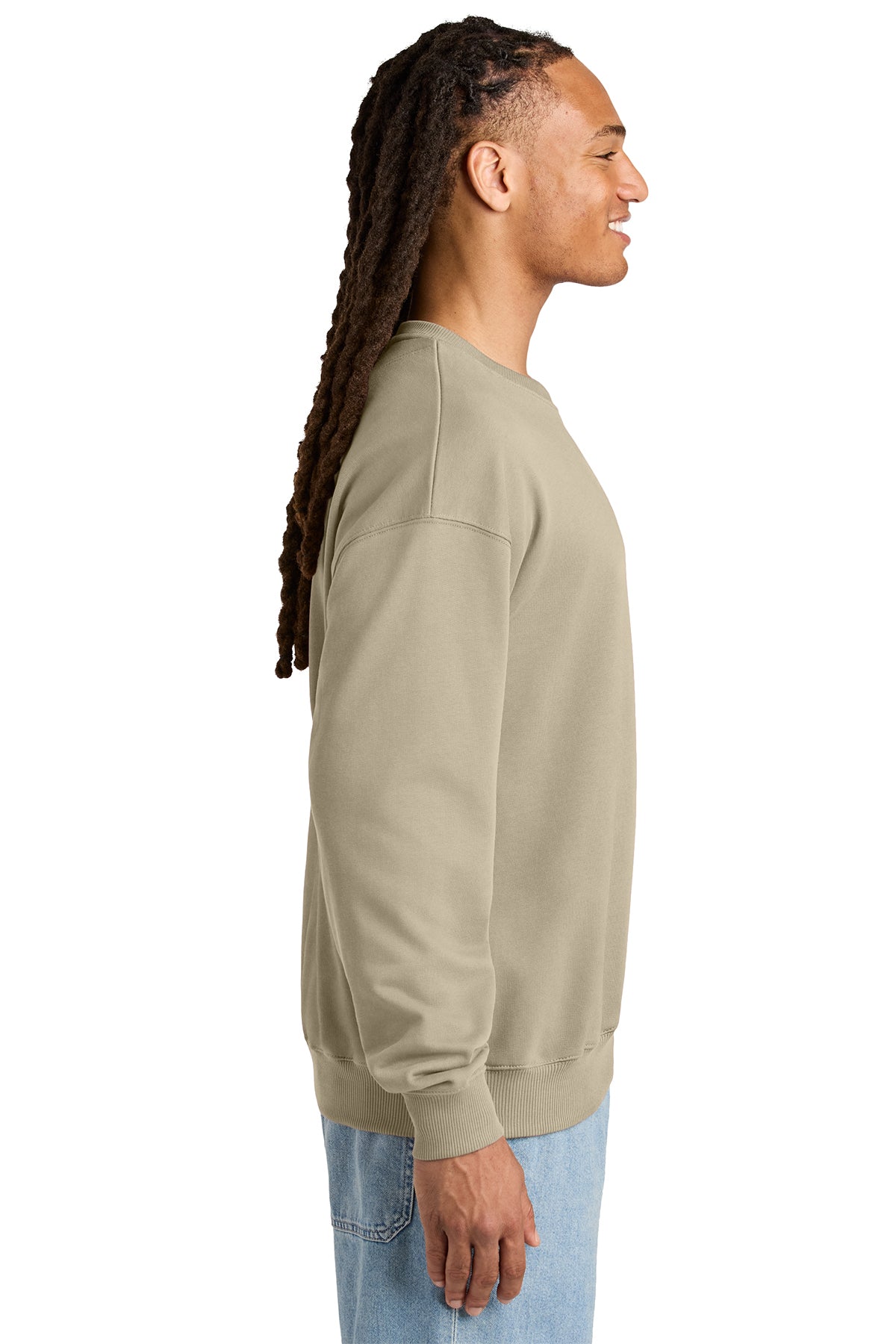 Stanley/Stella Unisex Ledger Dry Crewneck Sweatshirt in Desert Dust, side on model