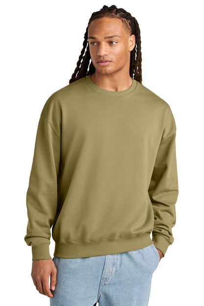 Stanley/Stella Unisex Ledger Dry Crewneck Sweatshirt in Faded Olive, front on model