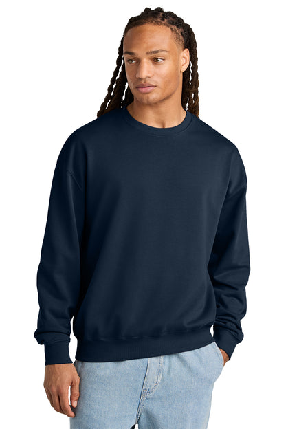 Stanley/Stella Unisex Ledger Dry Crewneck Sweatshirt in French Navy, front on model