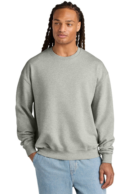 Stanley/Stella Unisex Ledger Dry Crewneck Sweatshirt in Heather Grey, front on model