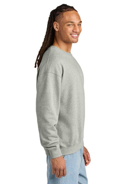 Stanley/Stella Unisex Ledger Dry Crewneck Sweatshirt in Heather Grey, side on model