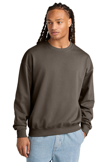 Stanley/Stella Unisex Ledger Dry Crewneck Sweatshirt in Mocha, front on model
