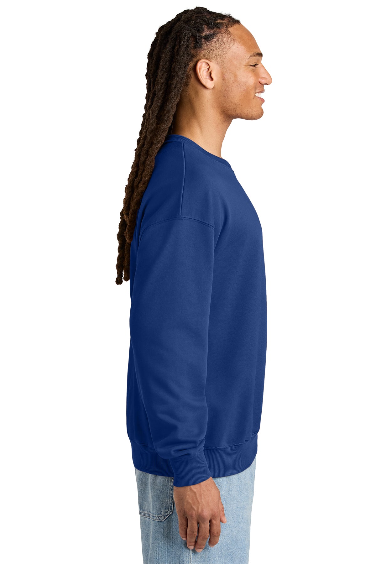 Stanley/Stella Unisex Ledger Dry Crewneck Sweatshirt in Worker Blue, side on model