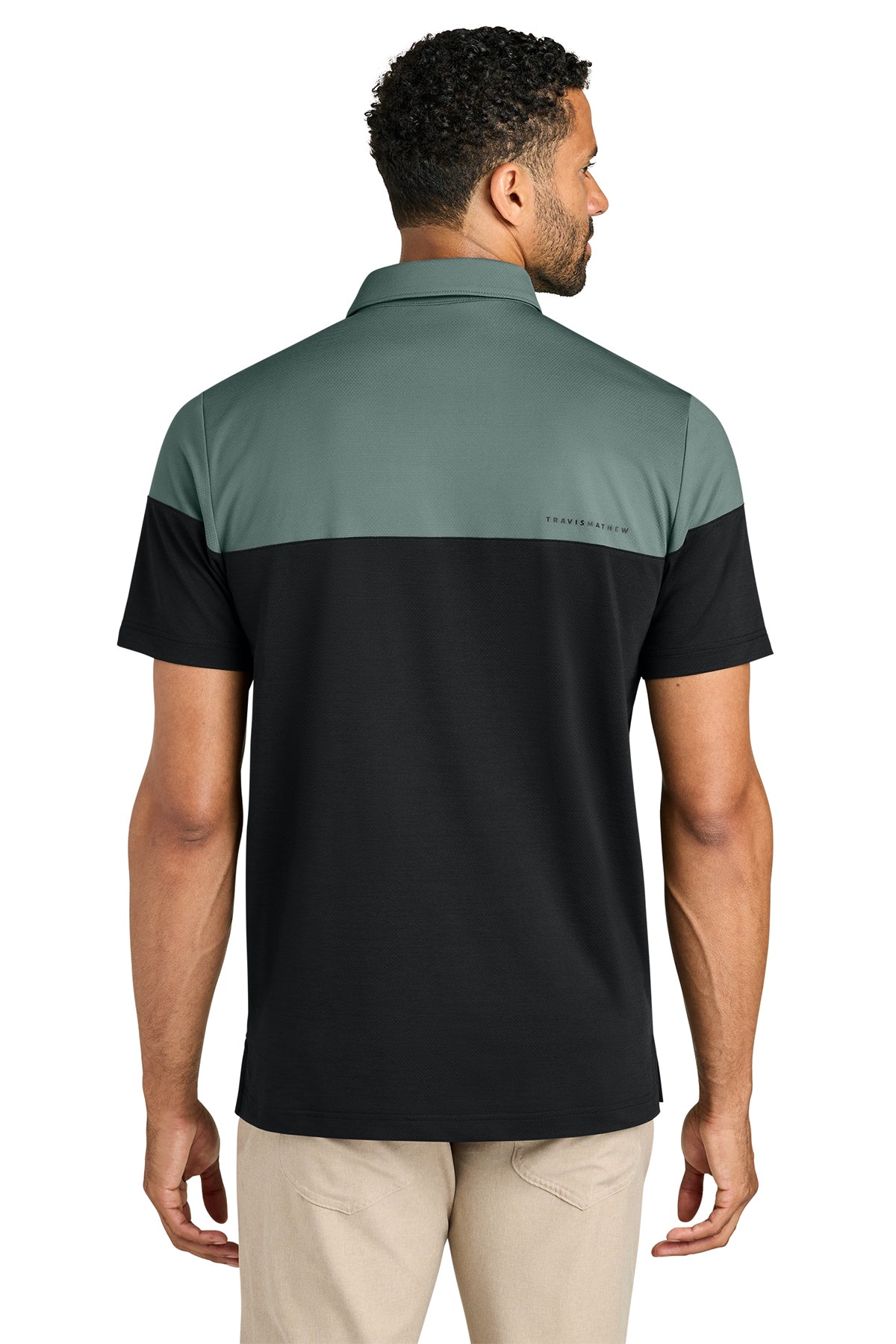TravisMathew Onward Colorblock Polo in Balsam Green/ Black, back on model