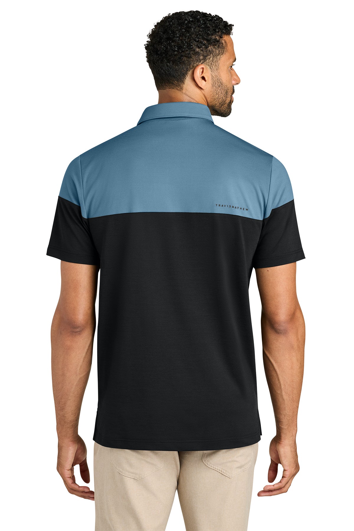 TravisMathew Onward Colorblock Polo in Copen Blue/ Black, back on model