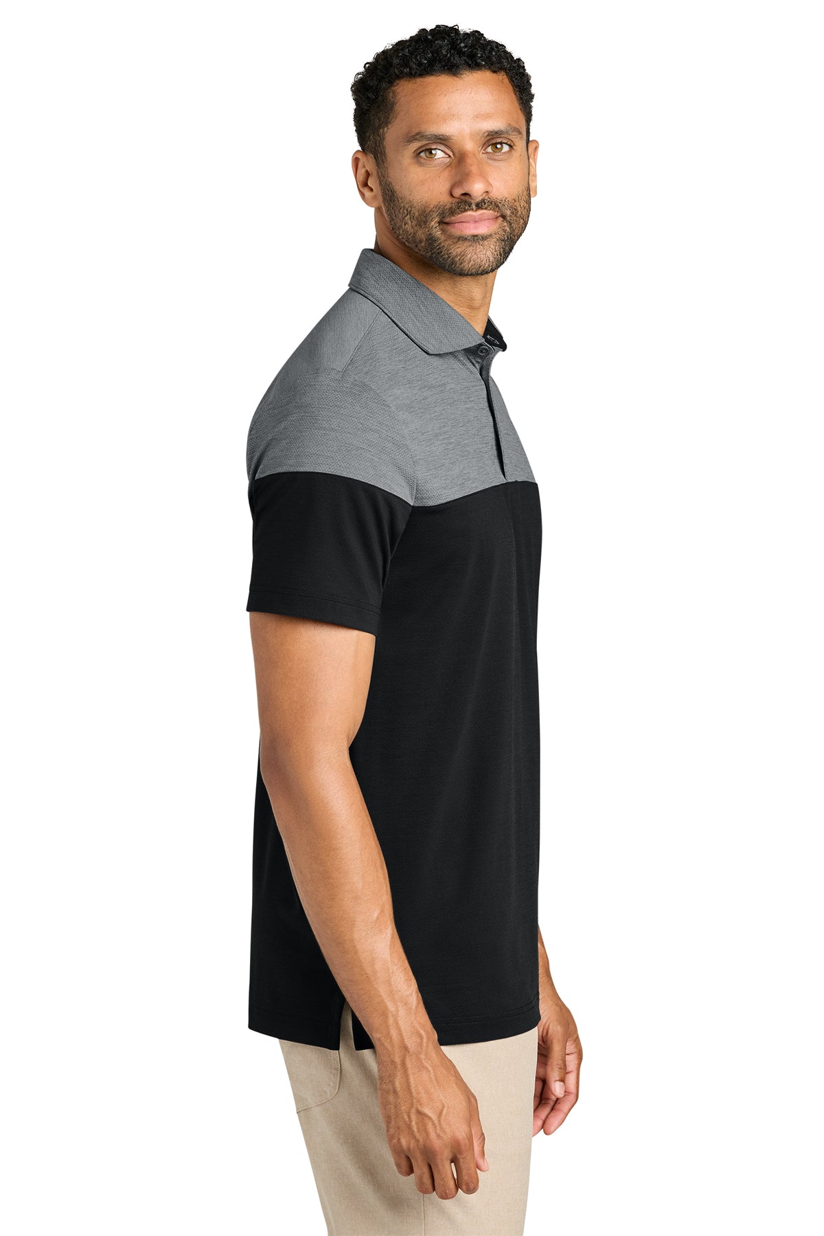 TravisMathew Onward Colorblock Polo in Quiet Shade Grey Heather/ Black, side on model
