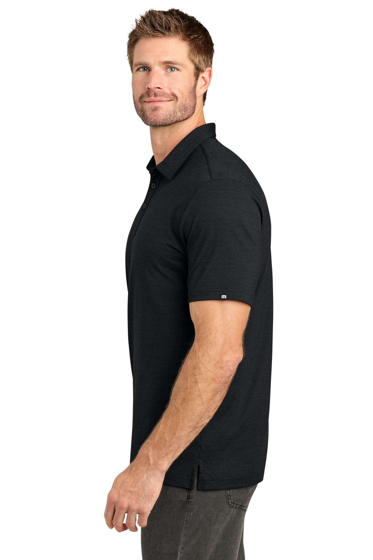 TravisMathew Crestview Polo in Black, side on model