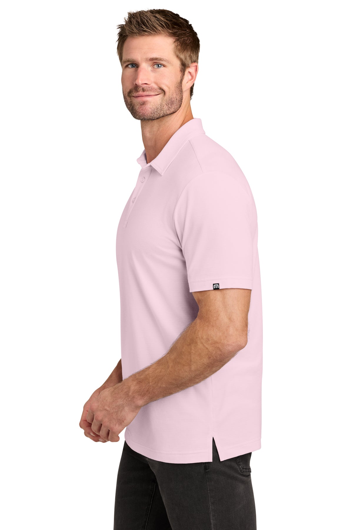TravisMathew Crestview Polo in Stone Pink, side on model
